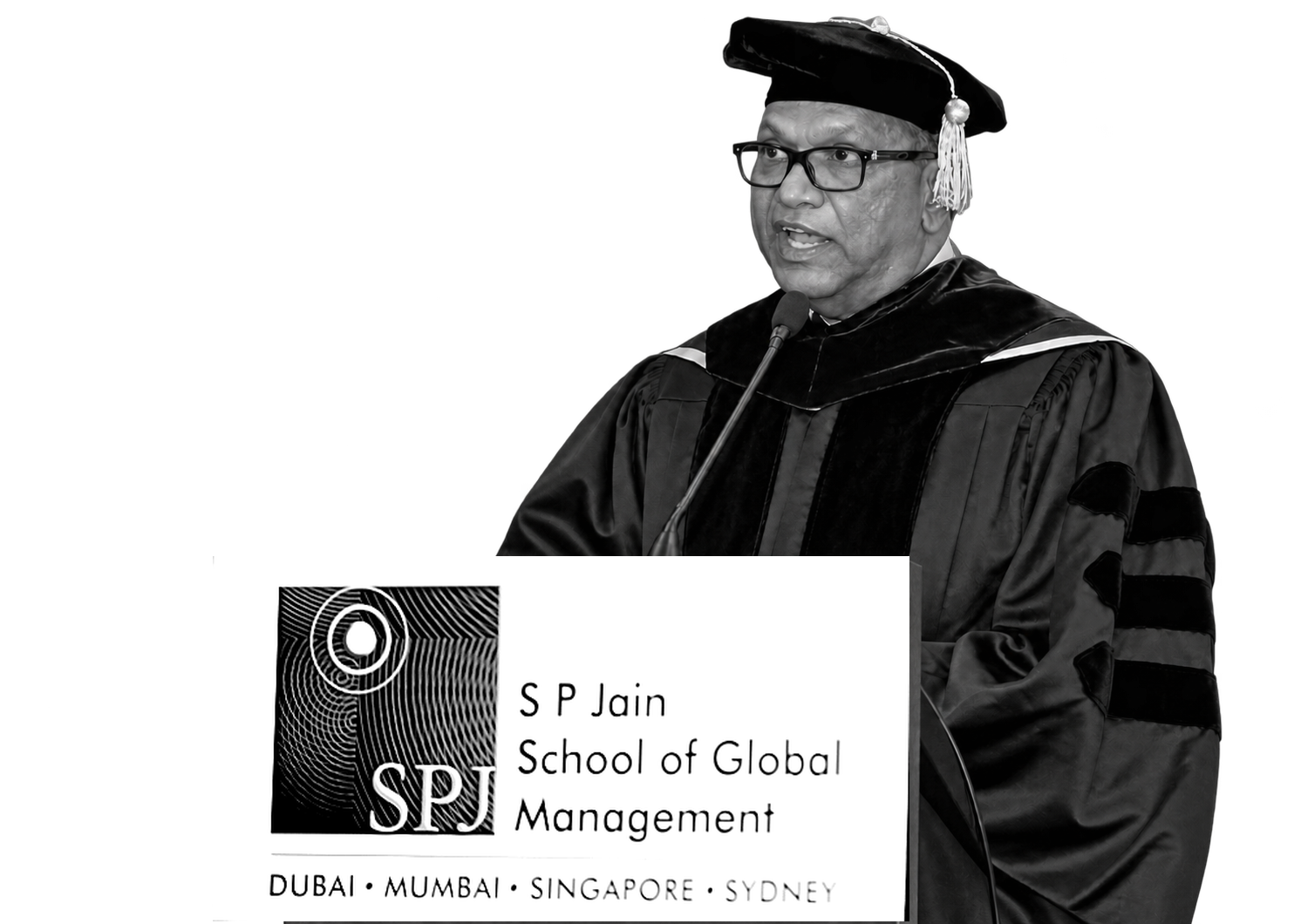 Dr Balakrishna Grandhi speaking in academic robes at a lectern